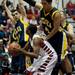 Milan senior Allen Gardette is guarded by Chelsea defenders on Friday. Daniel Brenner I AnnArbor.com